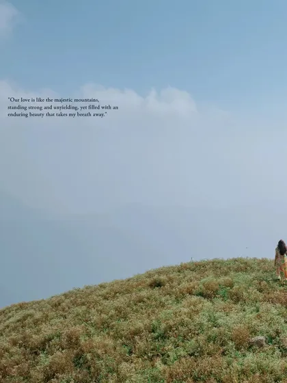 A wide, scenic shot of a woman on a vast green hillside in Mussoorie, emphasizing the scale and beauty of destination photoshoots.