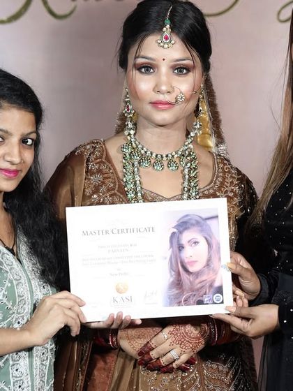 A proud moment for this student, receiving her Master Certificate after creating a stunning final look.