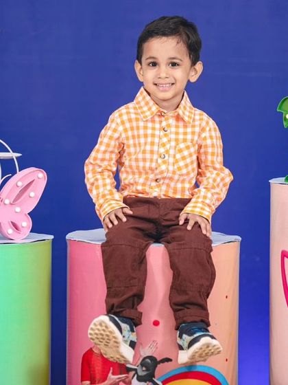 A vibrant 'Pokemon' themed birthday party, with character cutouts, a custom backdrop of the Kanto region, and red and white balloons, ready for a Pokemon battle.