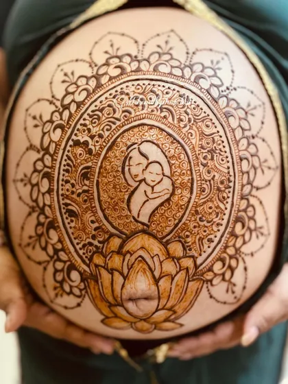Belly henna is such a beautiful way to celebrate pregnancy. I created this intricate mother and child portrait surrounded by a lotus mandala, making it a memorable part of the maternity journey.