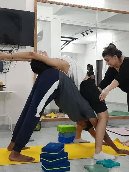 Another dynamic partner pose where students work together to create shapes, building strength and trust in the process.