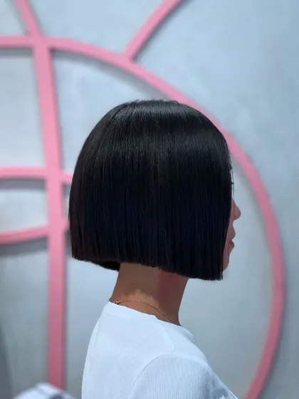 A sharp, blunt bob is all about precision. For this look, I used my clippers to create an impeccably clean line, resulting in a timeless and powerful style. This haircut is perfect for anyone wanting a chic and low maintenance look that still makes a statement.