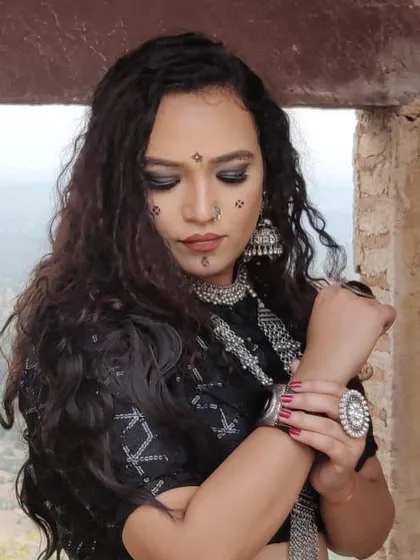A detailed shot of the makeup and jewelry for the 'Jogan' music video. The smoky eyes and intricate face markings were a crucial part of the overall character design.