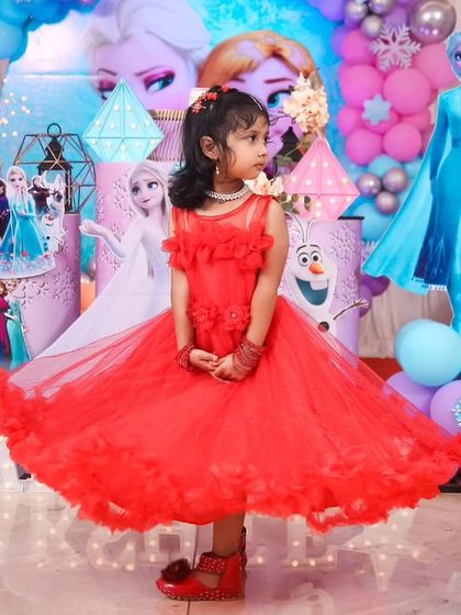 A magical 'Mermaid' themed birthday party, with shimmering blue and green decor, seashell props, and mermaid cutouts, creating an enchanting underwater world.