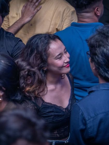 A candid moment captured on the dance floor at Flo.