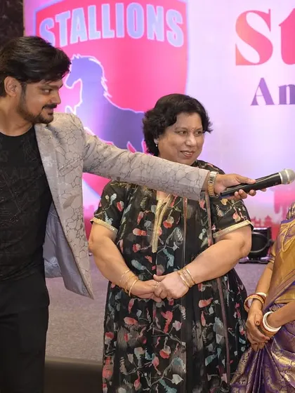 Engaging with guests during an interactive segment. I make sure everyone feels comfortable and has a good time, whether they are on stage or in their seats.