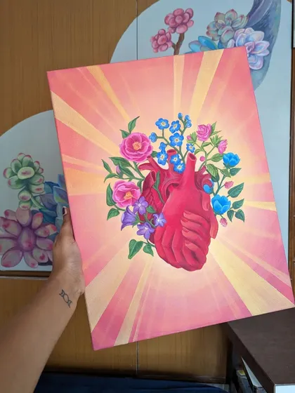 My work isn't limited to walls. I also create deeply personal art on canvas, like this piece featuring a floral anatomical heart. It represents love and life, painted with vibrant colors to be a statement piece for any room.