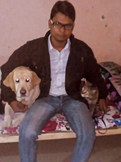 I provide a safe and welcoming environment for different types of pets to coexist peacefully. Here's a happy client with both a dog and a cat.