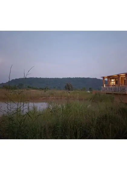 A serene view from the deck of the Waghoba Ecolodge, overlooking the lake and the hills. We created this water body to attract biodiversity and to serve as a beautiful, reflective foreground to the wilderness beyond.