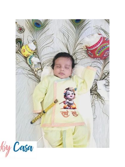 Welcoming your little Kanha. This newborn is celebrating his first Janmashtami, sleeping peacefully in our comfortable printed dhoti-kurta set.