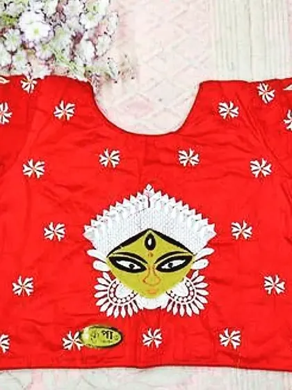Another special Durga Puja blouse. This one features a yellow-faced Maa Durga applique at the center, with her eyes also embroidered on the sleeves for a unique design.