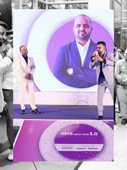 A shot of me on stage with the main speaker, whose image is projected on the large screen behind us.