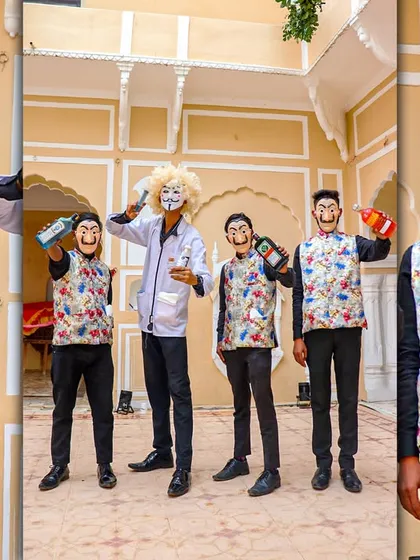I bring unique themes to life to match your event's vibe. Here, my team, dressed in themed costumes with Money Heist masks, adds an element of surprise and fun while serving drinks during a baraat procession.