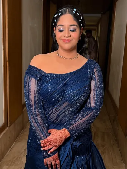 This image captures her joyful expression. The makeup is designed to be comfortable and long-lasting, so she can enjoy her event without any worries.