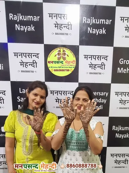 Two happy clients showing off their festive mehndi at our studio. We love being a part of your celebrations, big or small.