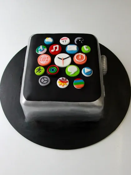 Another angle of the iWatch cake, showing the 3D structure and silver finish.
