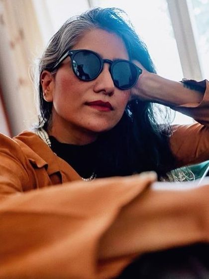 A different perspective on the rock-chic look, highlighting the relaxed yet powerful vibe.