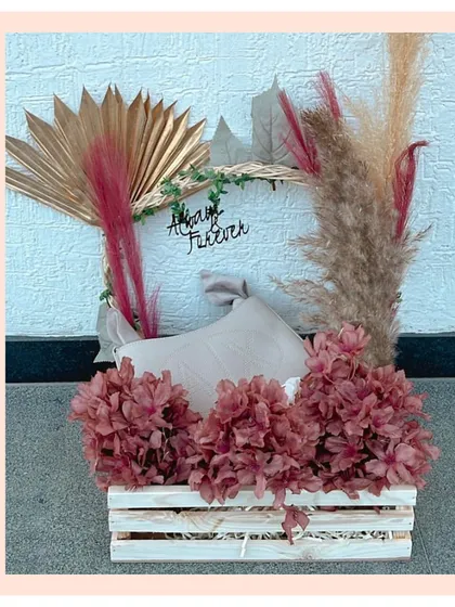 Gifting luxury products in style. We created this rustic yet chic hamper in a wooden crate with dried florals to beautifully present an Armani Exchange gift.