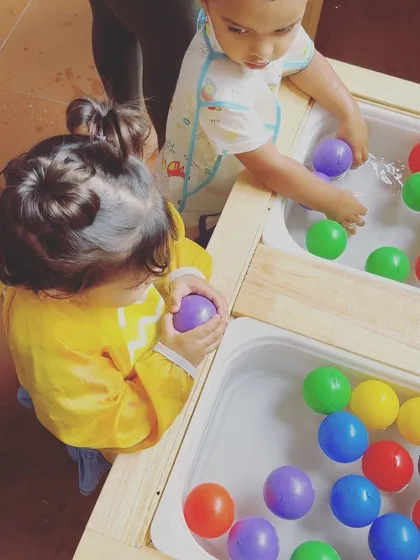 Another view of children enjoying the water tables, fully absorbed in their play. Providing these opportunities for self-directed exploration is at the heart of what I do.