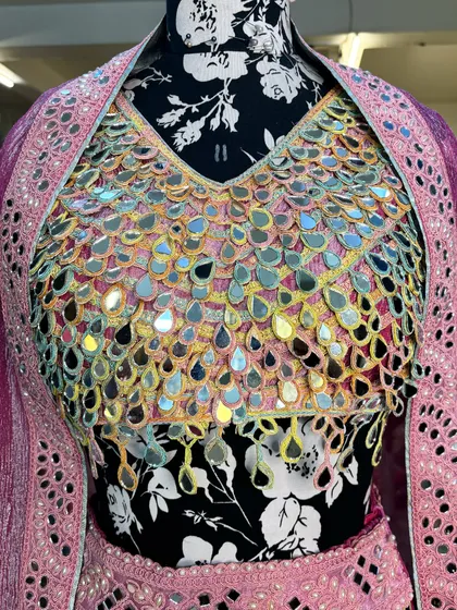 A close-up of the blouse, where we have used original mirrors to create this stunning, light-catching effect.
