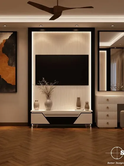 This bedroom features a custom TV and vanity unit. The design incorporates clean lines, a white finish, and herringbone wooden flooring, creating a functional and stylish corner in the room.