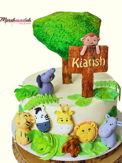 Creating sweet memories with this adorable animal farm cake for Kiansh's fourth birthday. This 2kg Salted Caramel and Biscoff cake features a whole crew of edible animal friends.