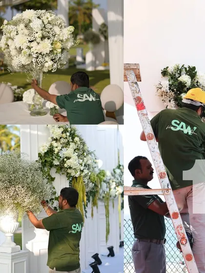 More behind-the-scenes shots of my team assembling the decor for a large-scale white wedding. From placing centerpieces to climbing ladders to fix arches, we manage every detail of the floral production.