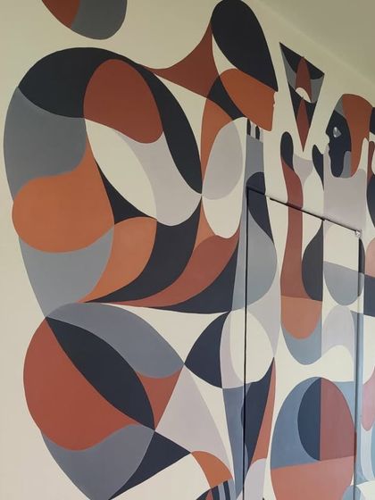 A detail of the geometric mural, showing the interplay of shapes and colors.