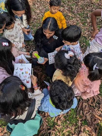A huddle of young entomologists, completely absorbed in their bug-finding mission. Using our journals and viewers, they learn to identify and document their discoveries.