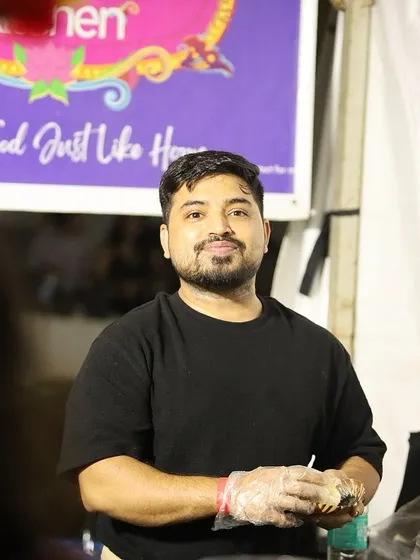 A candid shot of Ankur at our food stall, focused and ready to serve. We put our heart into every single order.
