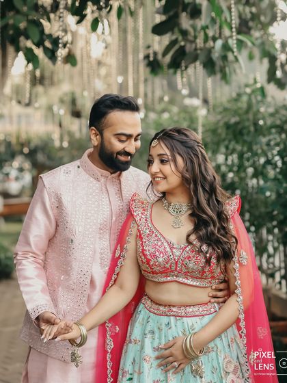 The look of love. We create the perfect setting, but it's the connection between the couple that brings the magic. This is a beautiful candid moment from their pastel-themed Haldi ceremony.