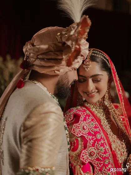 The quiet moments are just as important as the grand ones. I ensure the couple has moments of intimate connection, like this gentle forehead touch, which speaks volumes about their bond amidst the celebration.