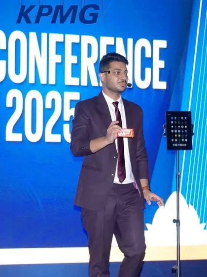 On stage at the KPMG Risk Conference, performing a routine with a Rubik's cube and my iPad. This act blends a physical puzzle with digital magic for a truly unique illusion.