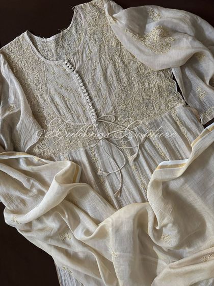 A close-up of the bodice, focusing on the heavy Chikankari work enhanced with Kutdana and sequins.
