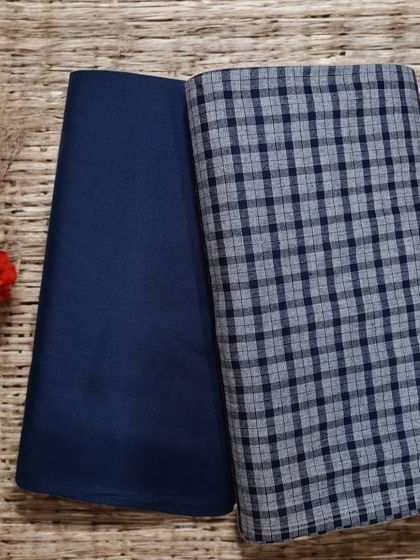 A subtle blue and grey plaid woolen fabric, ideal for smart and comfortable winter trousers or a co-ord set.