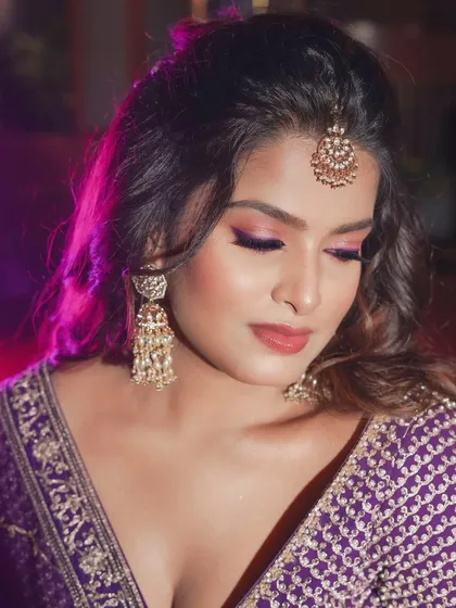 A close-up of the eye makeup. The colors are vibrant but blended softly for a romantic and glamorous feel.