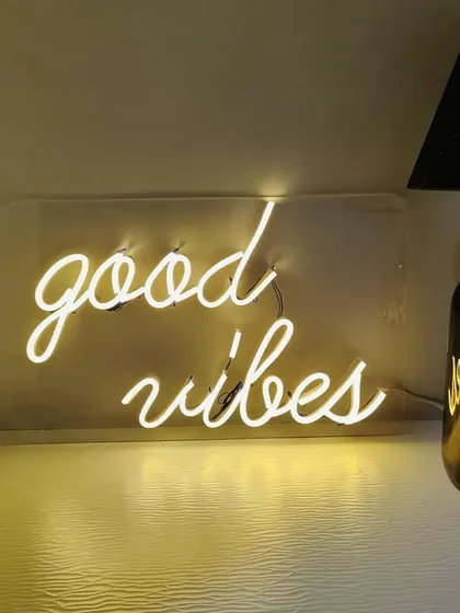 I provide custom neon signs to add a personal and trendy touch to your decor. This 'good vibes' sign is perfect for any event.