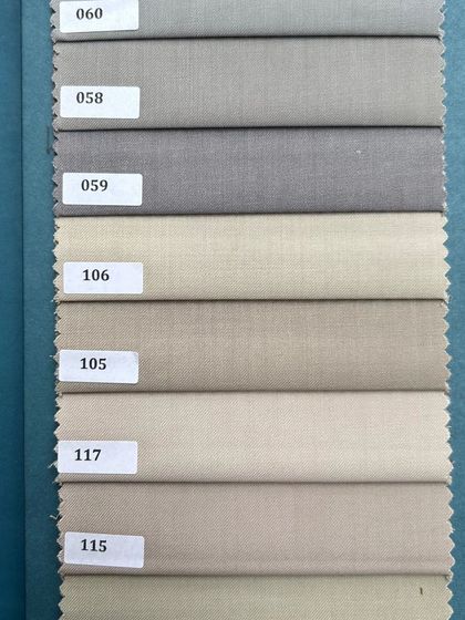Shades of grey and beige, essential for any well-rounded wardrobe. These fabrics can be tailored into trousers, blazers, or full suits.