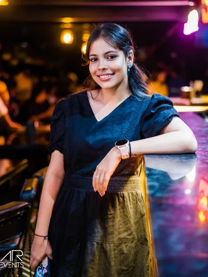 A guest posing at the bar.