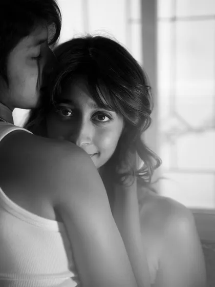 An intimate at-home portrait where the direct eye contact creates a powerful connection. I focus on capturing these honest, in-between moments that reveal the trust and comfort you share.