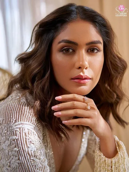 It's all in the details. This close-up highlights the intricate beadwork on the jacket and the delicate CaratLane jewelry we chose to complete Mrunal's elegant ensemble.