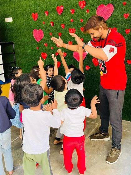 High fives all around after a successful activity. I make sure to celebrate every child's effort and participation, building their self-esteem and positive association with physical activity.