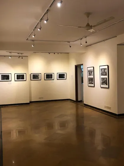 Another perspective of the gallery, showing the flow and arrangement of the framed photographs. We design our exhibition spaces to guide visitors through a compelling visual narrative.