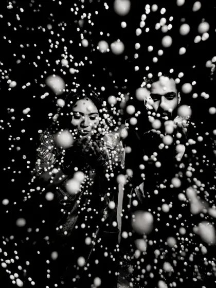 A creative black and white portrait using a spray of water to create a 'starburst' effect. This experimental technique results in a dynamic and abstract image that is full of energy.
