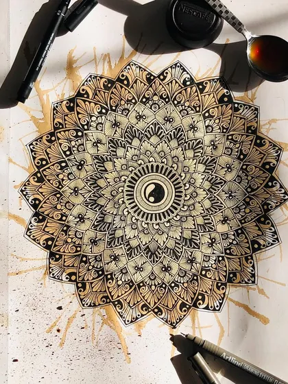 Experimenting with coffee-staining to give this yin-yang mandala an aged, unique look. My sketchbook is a place for play and trying new techniques.