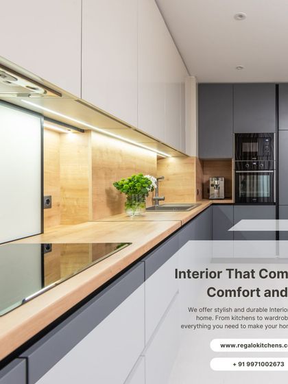 Comfort and style come together in this L-shaped kitchen. The combination of grey cabinets and a warm wood countertop creates a balanced and inviting look. Under-cabinet lighting illuminates the workspace, making meal prep a pleasure.