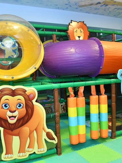 A close-up of the jungle-themed play structure at Banashankari, complete with a crawl tunnel and fun animal cutouts. It’s designed to spark imagination and encourage exploration.