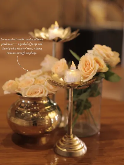 It's the small details that tell the biggest stories. These custom lotus-inspired candle stands, paired with delicate ivory and peach roses, added a touch of serene beauty and symbolism to the table settings, echoing a theme of purity and romance.