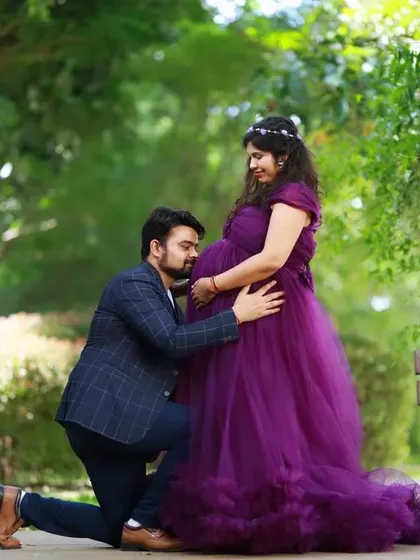 Including your partner is a wonderful way to capture the shared joy of this special time. This outdoor couple's maternity photo shows a tender moment, creating a memory you will both treasure forever.