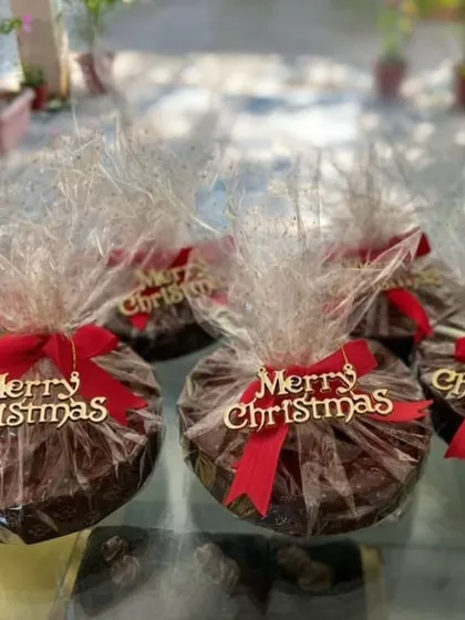 My festive corporate gifting options are perfect for the holiday season. These individually wrapped Christmas Rum & Fruit Cakes are a popular choice for bulk orders, offering a delicious and beautifully presented gift for clients and employees.